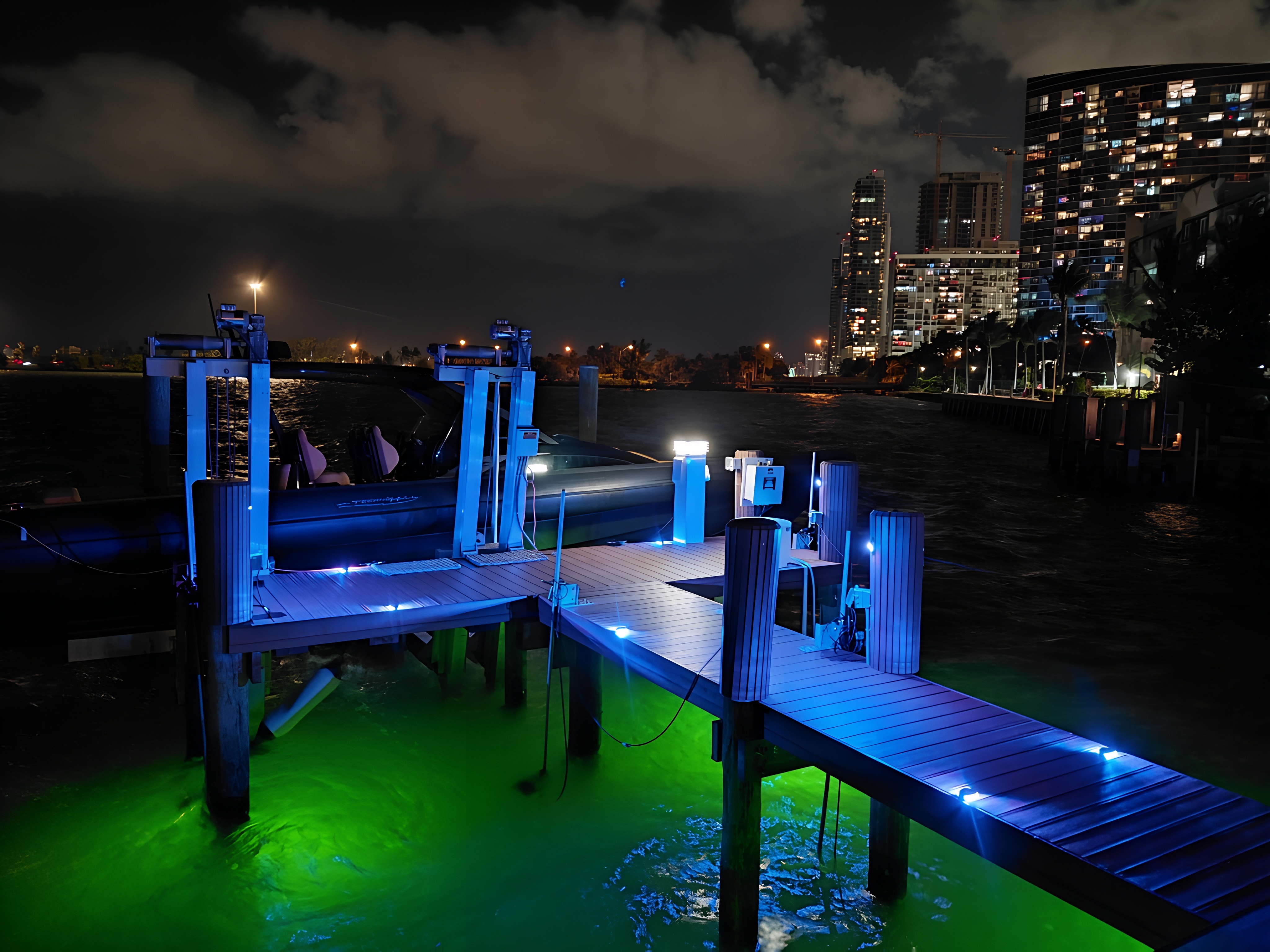 Custom Dock Lighting — Blue LED accent lights and green underwater pond lights, South Florida waterfront by Power Saver Electric Corp
