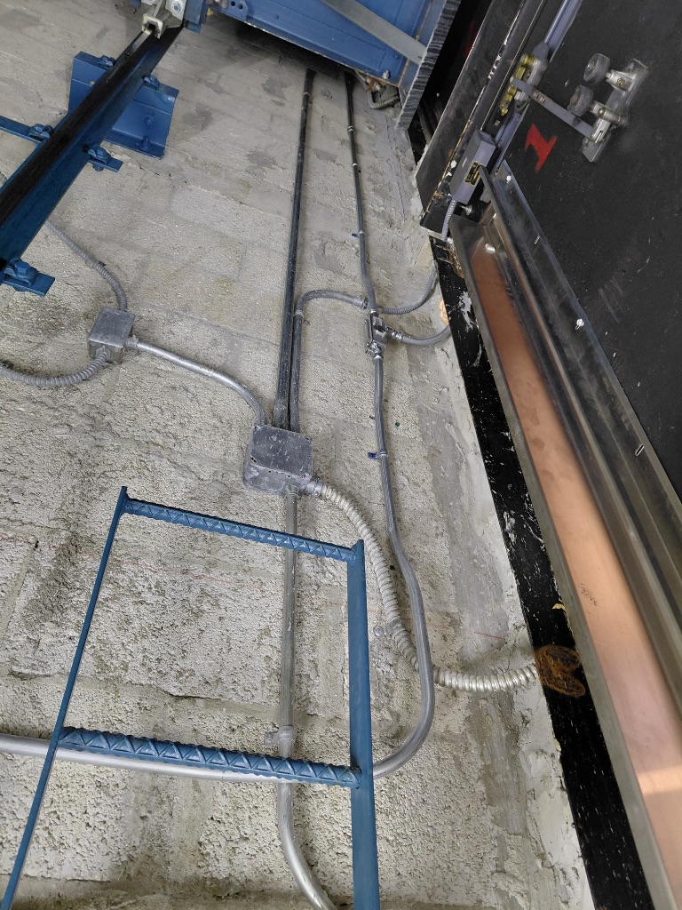 Elevator Hoistway — Conduit Runs, Junction Boxes & Guide Rail