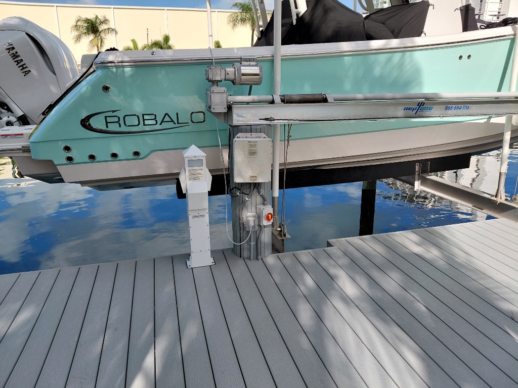 Robalo Boat on Lift — Multi-Color Dock Scene