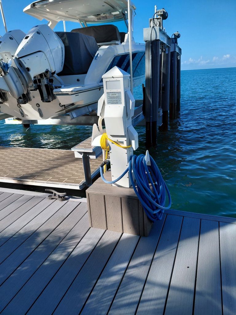Finished Shore Power Pedestal — Boat on Hoist, South Florida Keys
