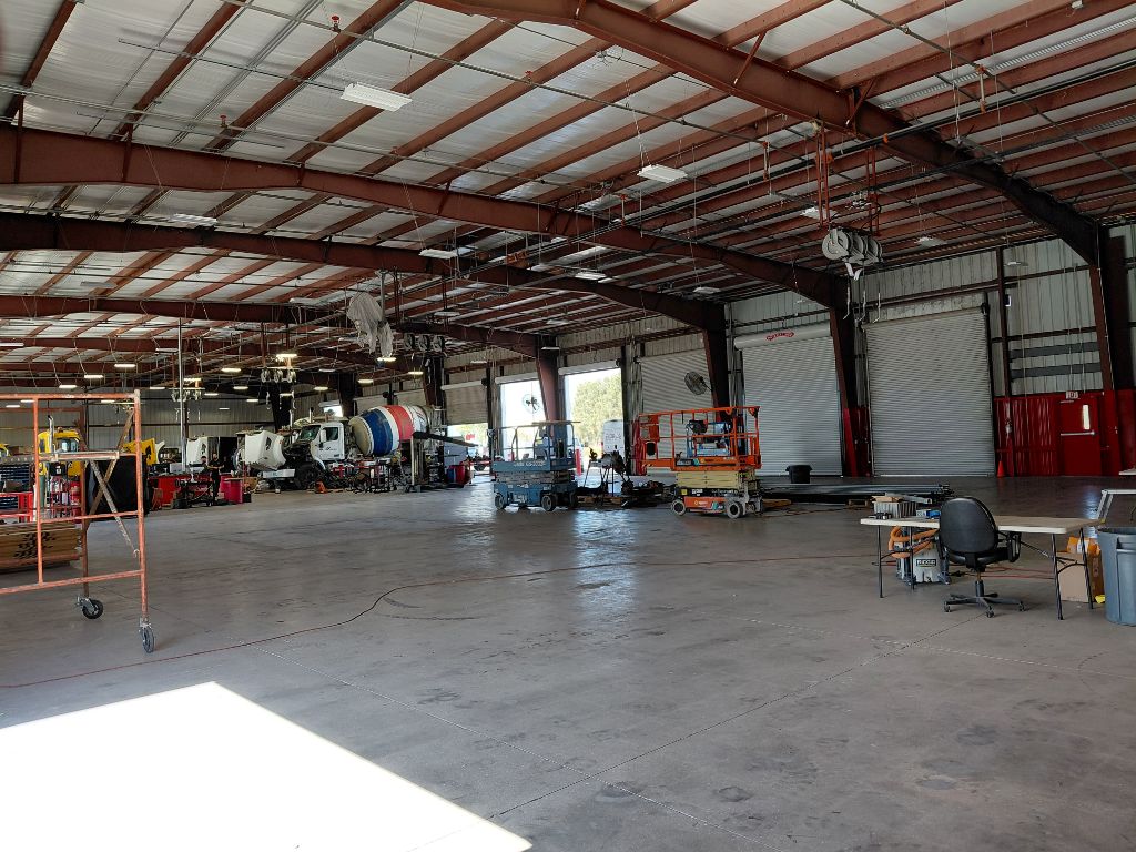 Peterbilt Heavy Equipment Facility — Wide Bay View with Scissor Lift & Service Trucks