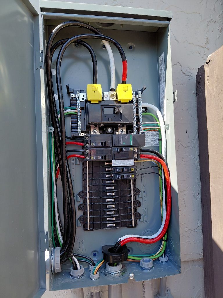 Marina Sub-Panel Open — Square D GFCI Breakers with Yellow Test Buttons and Shunt Trip