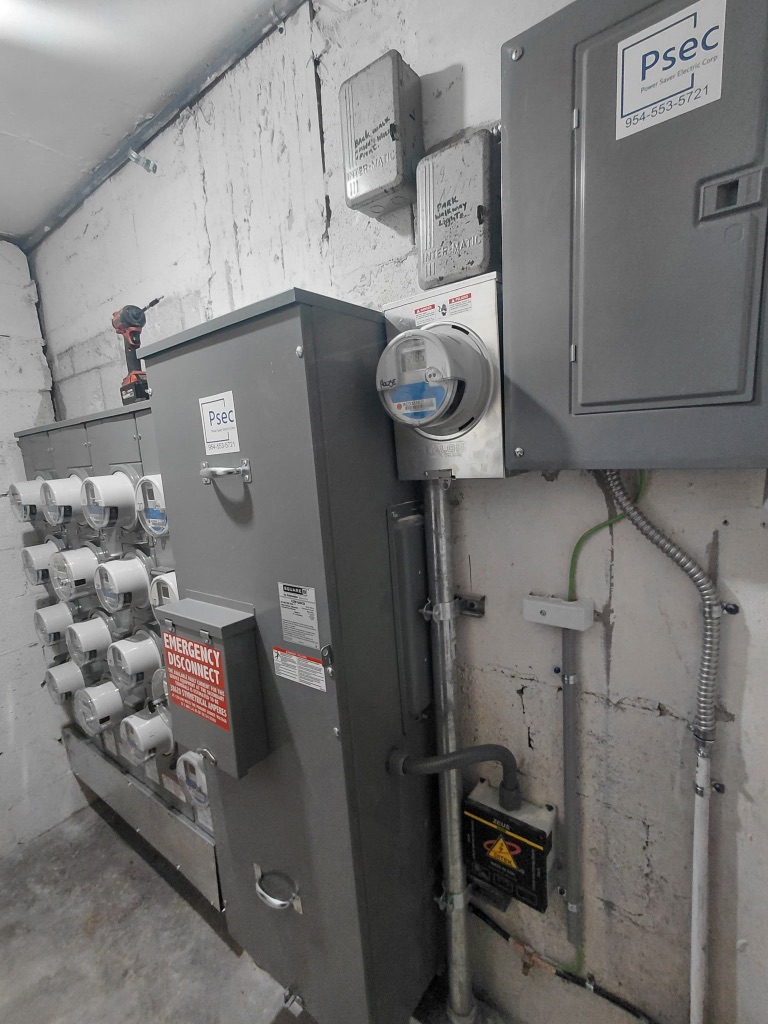 Install 2 Completed — Side Angle View, PSEC Label Top Right, Meter Socket, Emergency Disconnect, Intermatic Timers Above — PSEC