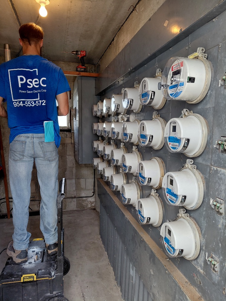 PSEC Technician Inspecting Existing Meter Bank — Before Upgrade, Meters Still in Service