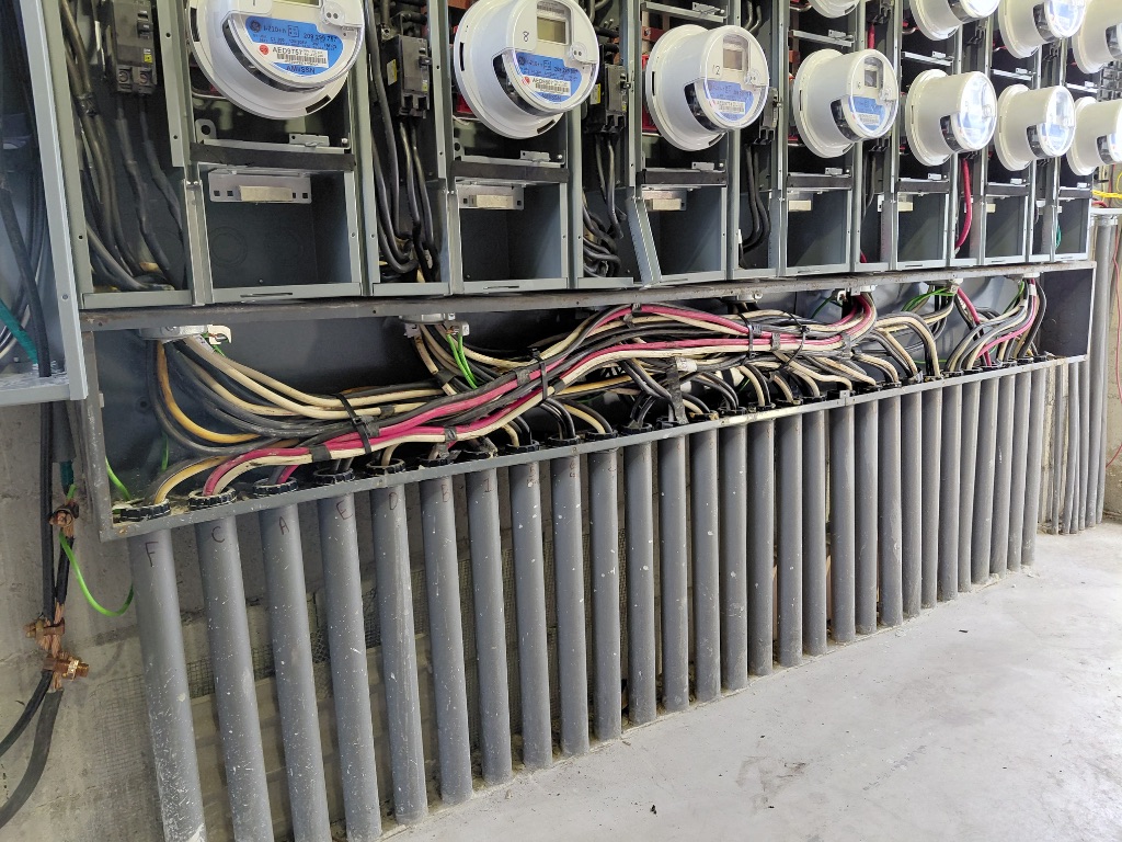 Meter Bank Trough — Color-Coded Conductors Routed Through Bottom Trough to Each Meter Socket
