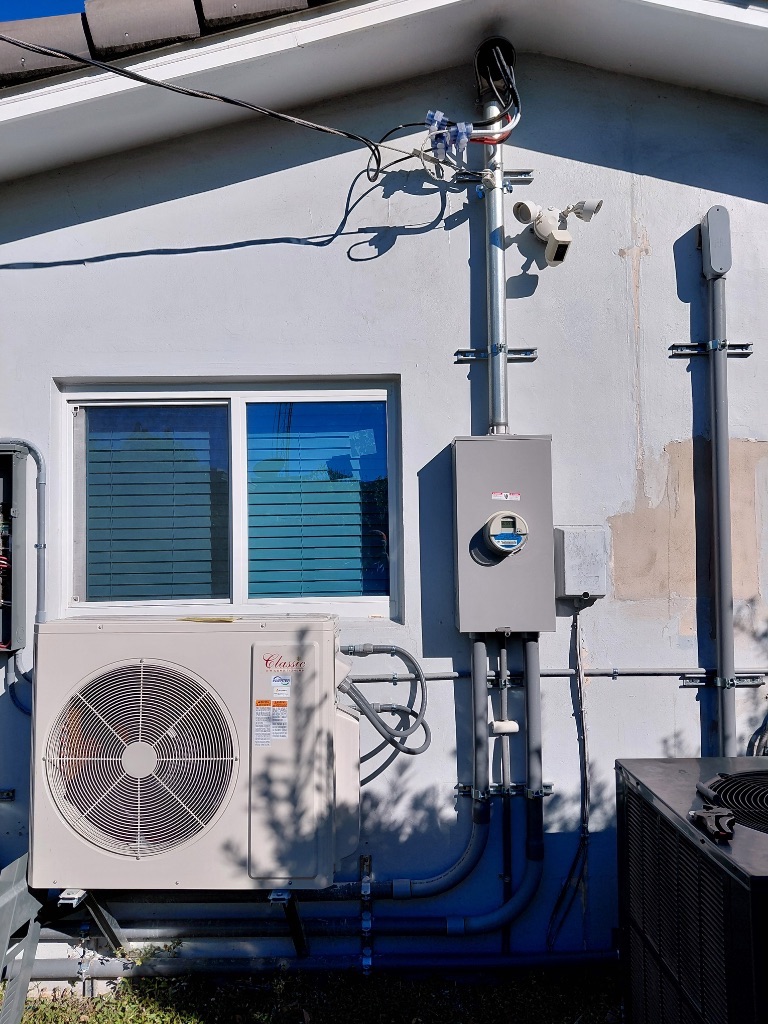 After — New Meter Socket & Service Mast Installed